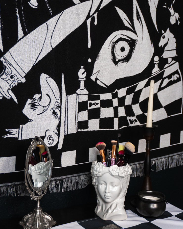 Close up of rabbit and mad hatter on vanity