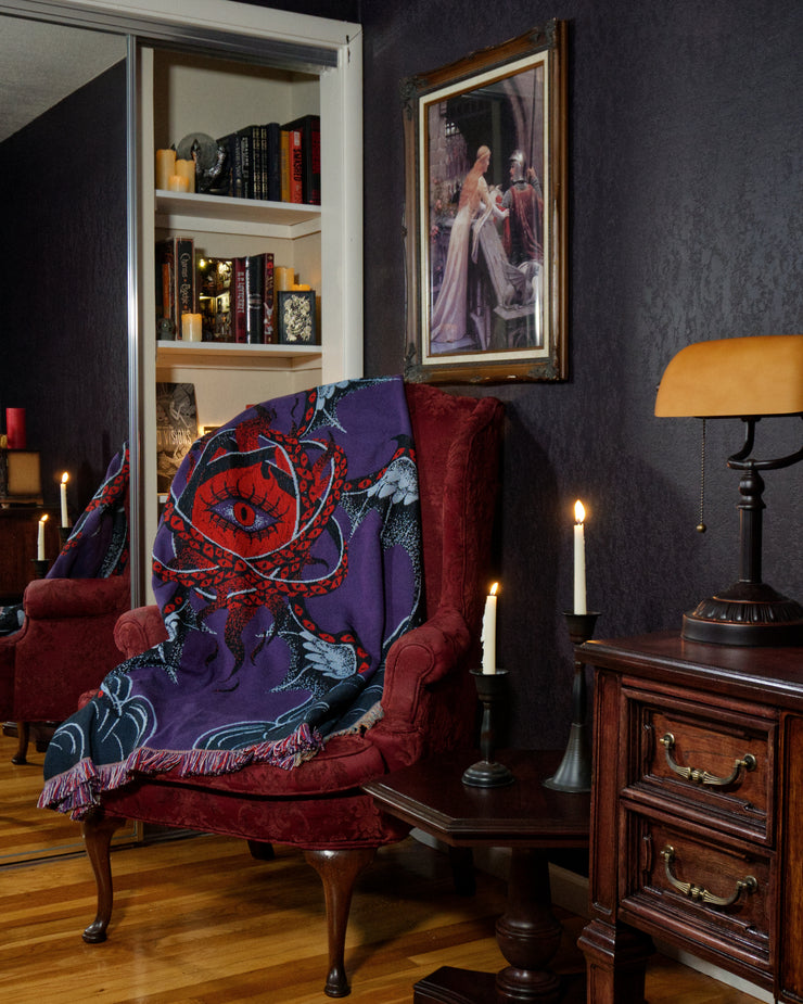 Mephisto draped on red chair.
