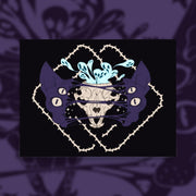 Four eyed sphynx cat head, split in the center with an exposed skull behind strings of skin. Blue ghouls escape within. Thorned frame design.
