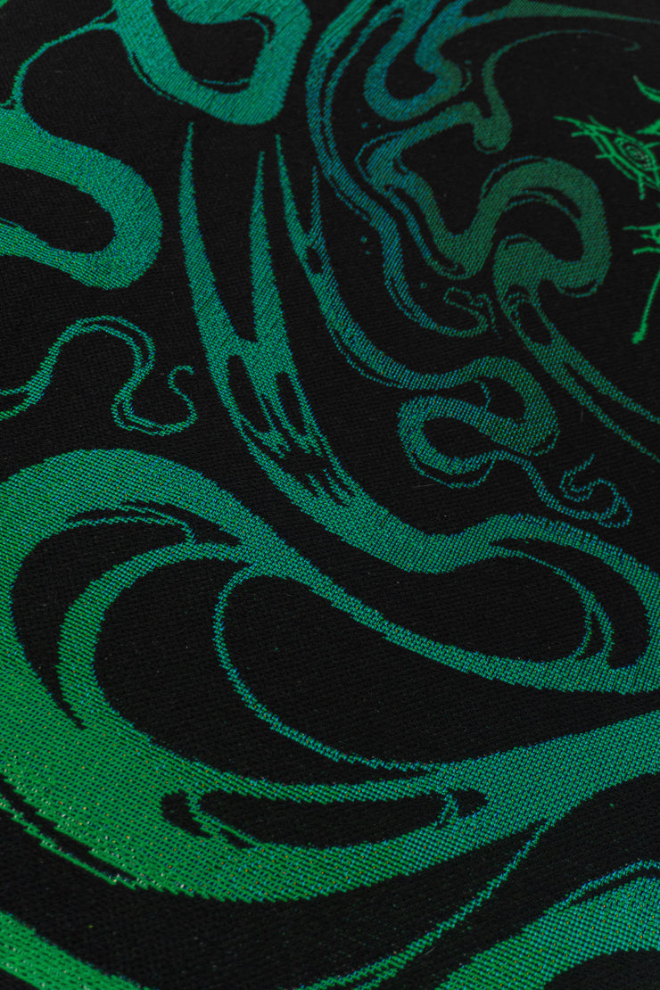 Underworld close up of a light green ghost figure and some smaller spirits set against black backdrop, swirling in the ghost portal.
